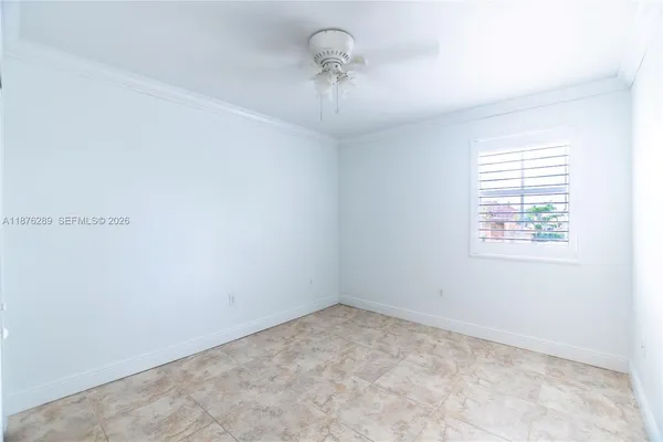 a bed room with a bed and a window