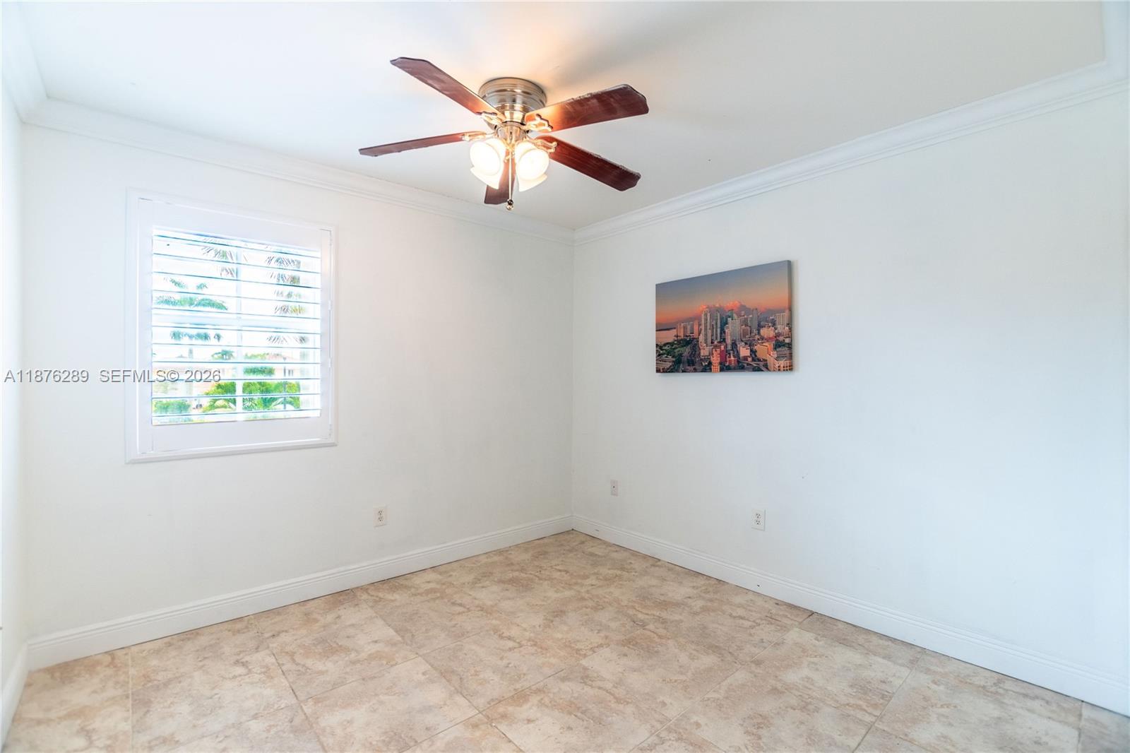 16335 Southwest 93rd Street Miami, FL 33196 - Photo 39 of 70 an empty room with windows and fan