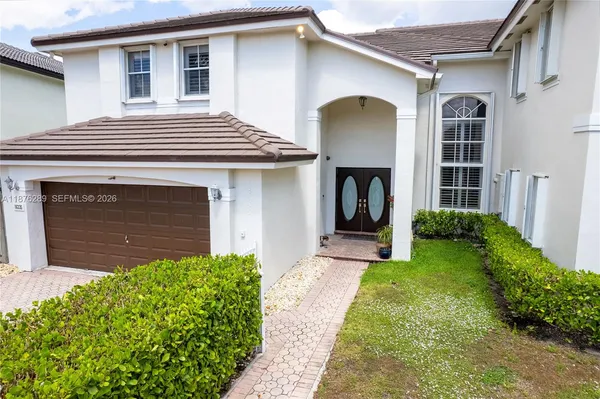 a front view of a house with a yard