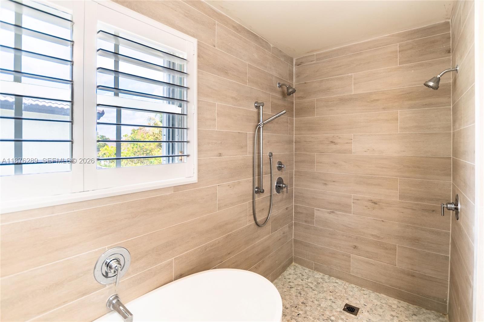16335 Southwest 93rd Street Miami, FL 33196 - Photo 47 of 70 a bathroom with a sink toilet a mirror and shower