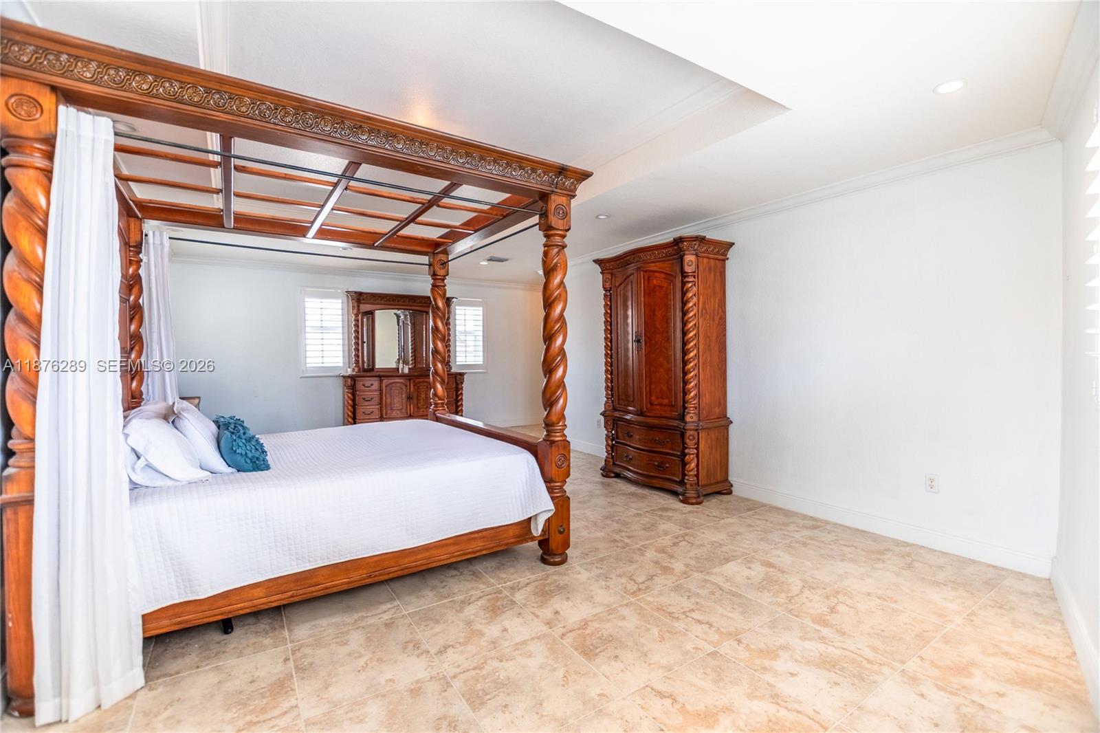 16335 Southwest 93rd Street Miami, FL 33196 - Photo 53 of 70 a bedroom with a bed and a mirror