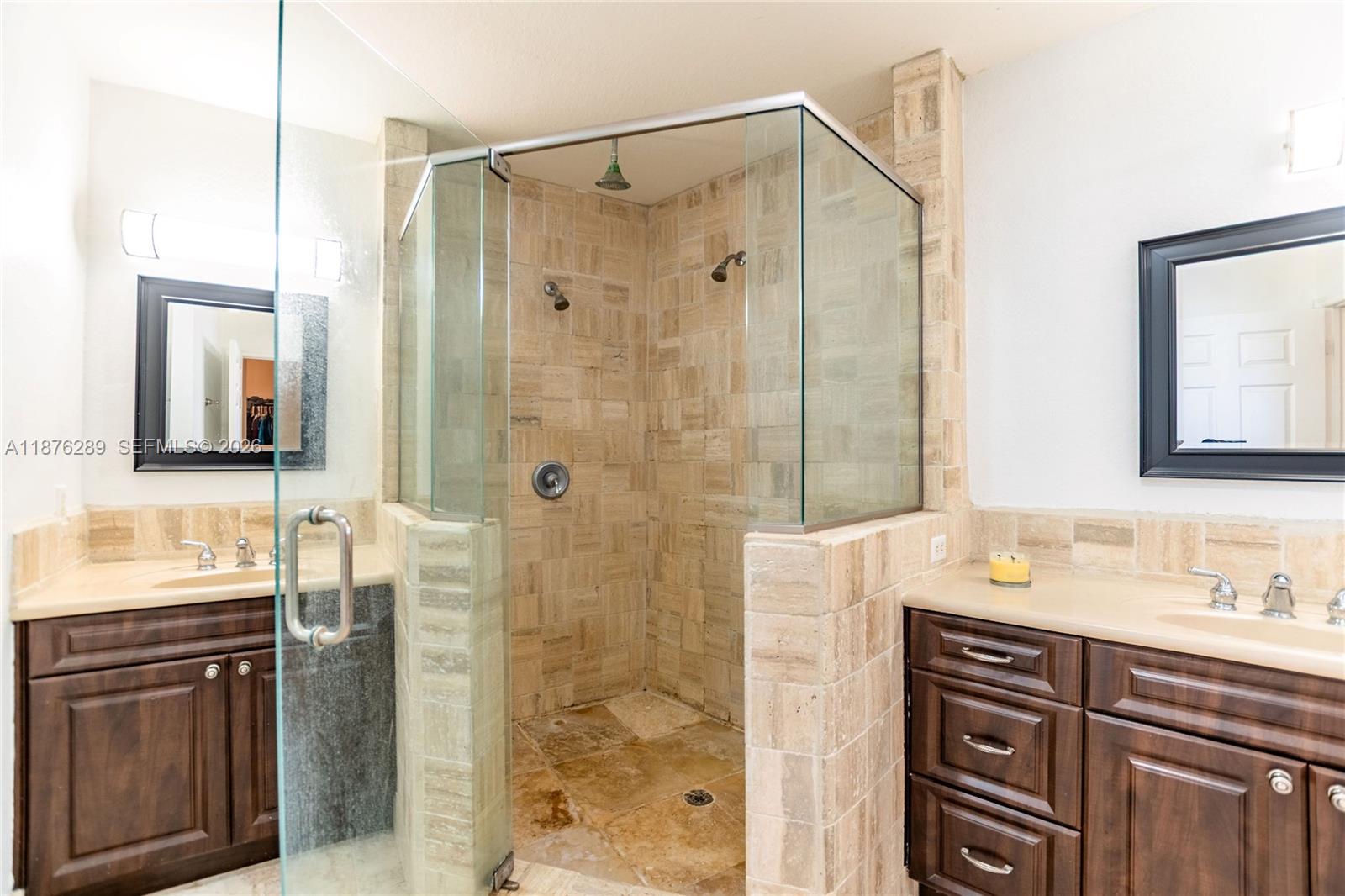 16335 Southwest 93rd Street Miami, FL 33196 - Photo 58 of 70 a bathroom with a shower sink and mirror