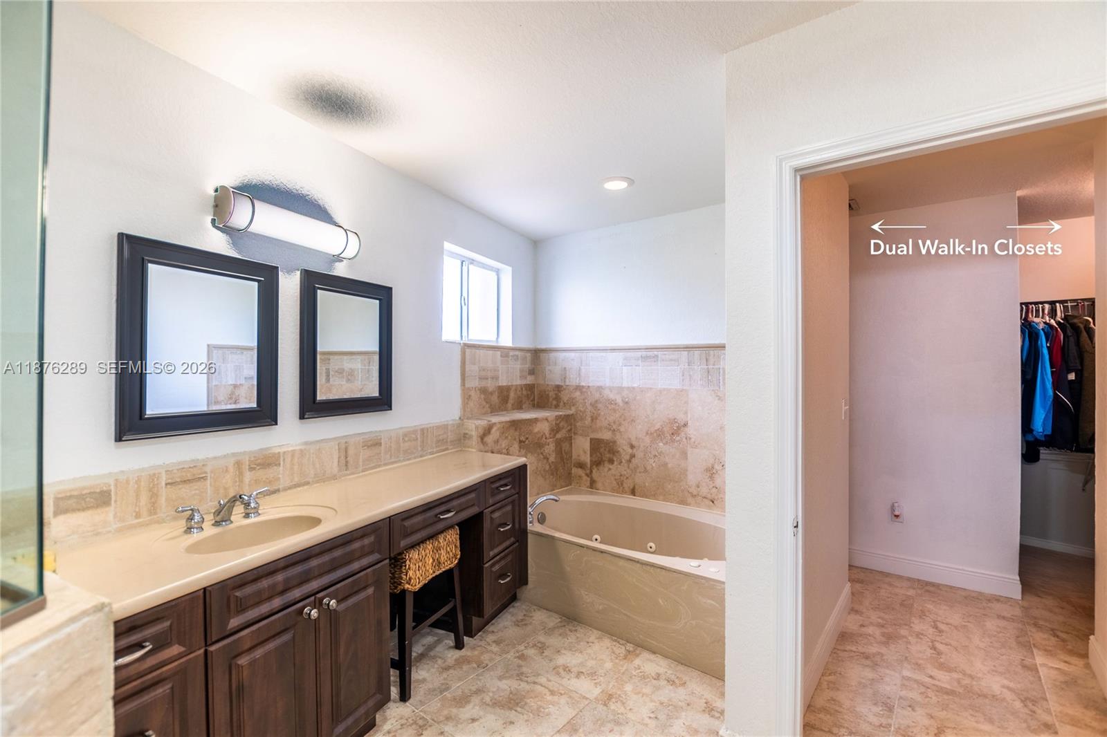 16335 Southwest 93rd Street Miami, FL 33196 - Photo 59 of 70 a bathroom with a tub sink and mirror