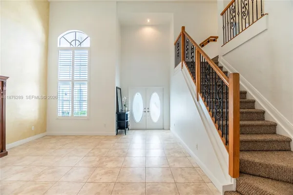 a view of a hallway with furniture and entryway