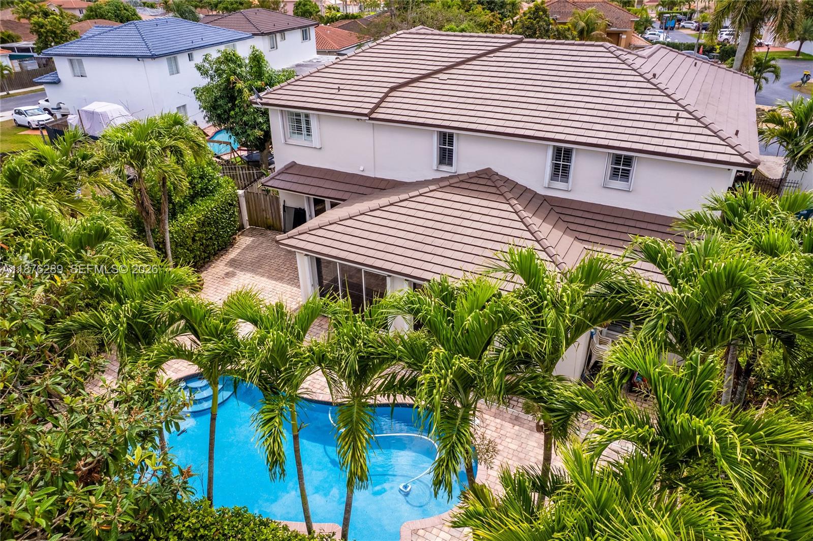 16335 Southwest 93rd Street Miami, FL 33196 - Photo 63 of 70 a view of a house with a yard and a garden