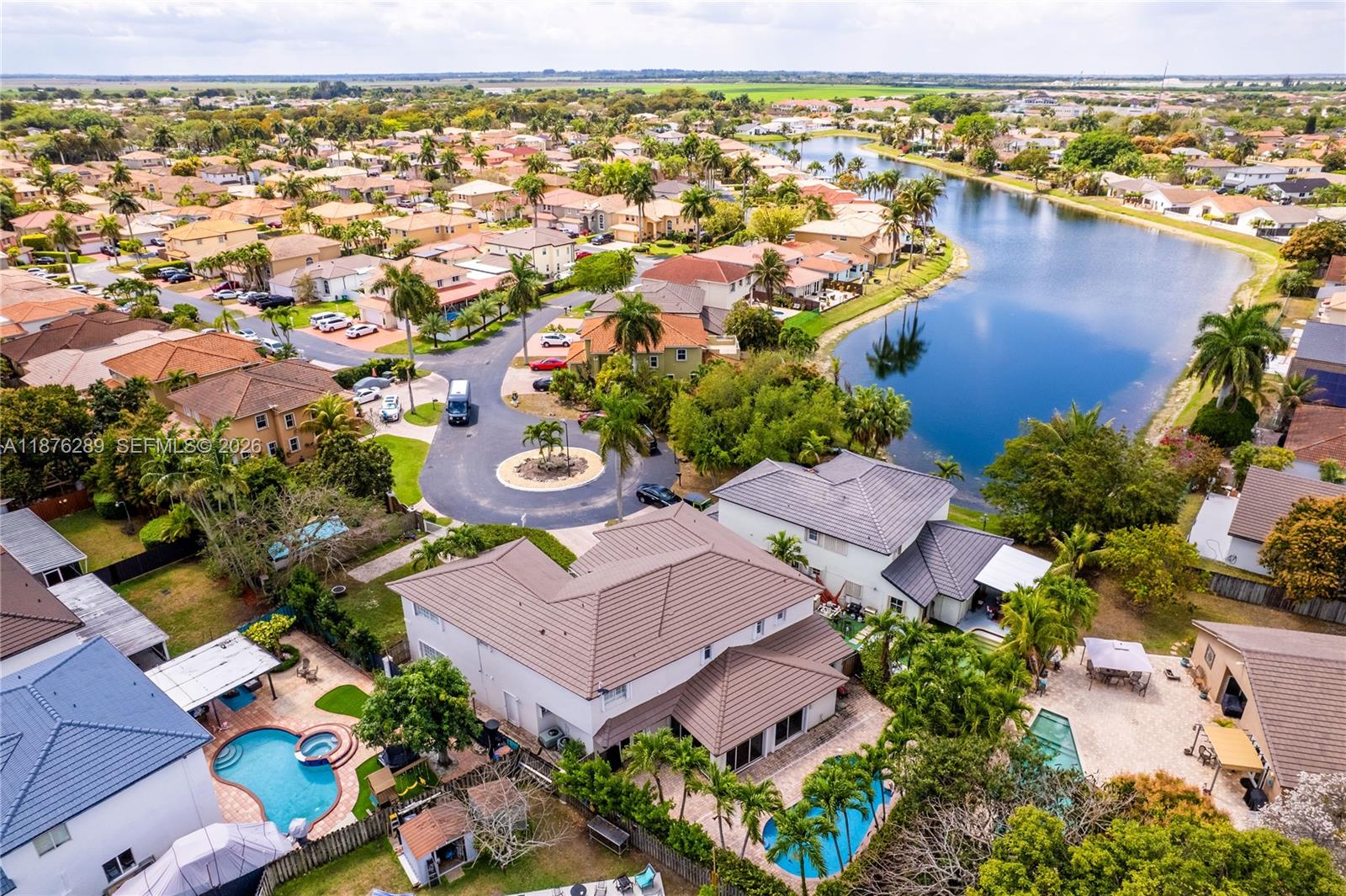 16335 Southwest 93rd Street Miami, FL 33196 - Photo 68 of 70 an aerial view of residential houses with outdoor space