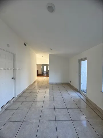 a view of an empty room and window