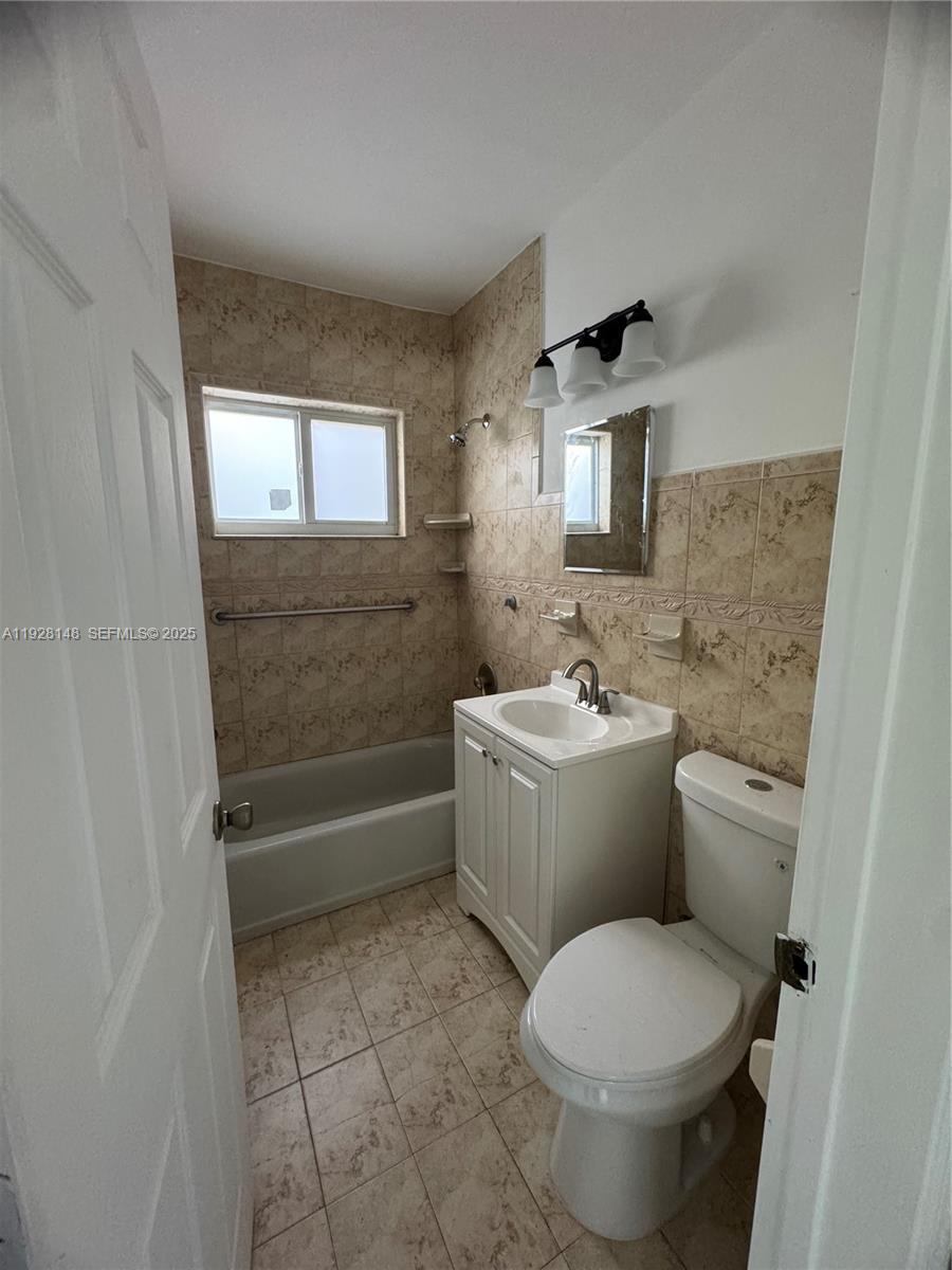 3021 Southwest 2nd Avenue Miami, FL 33129 - Photo 25 of 29 a bathroom with a toilet sink and mirror