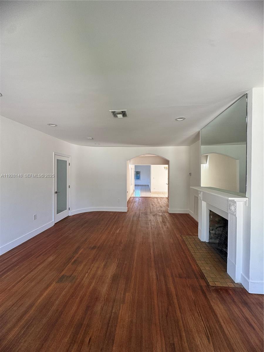 3021 Southwest 2nd Avenue Miami, FL 33129 - Photo 4 of 29 a view of empty room with fireplace and wooden floor