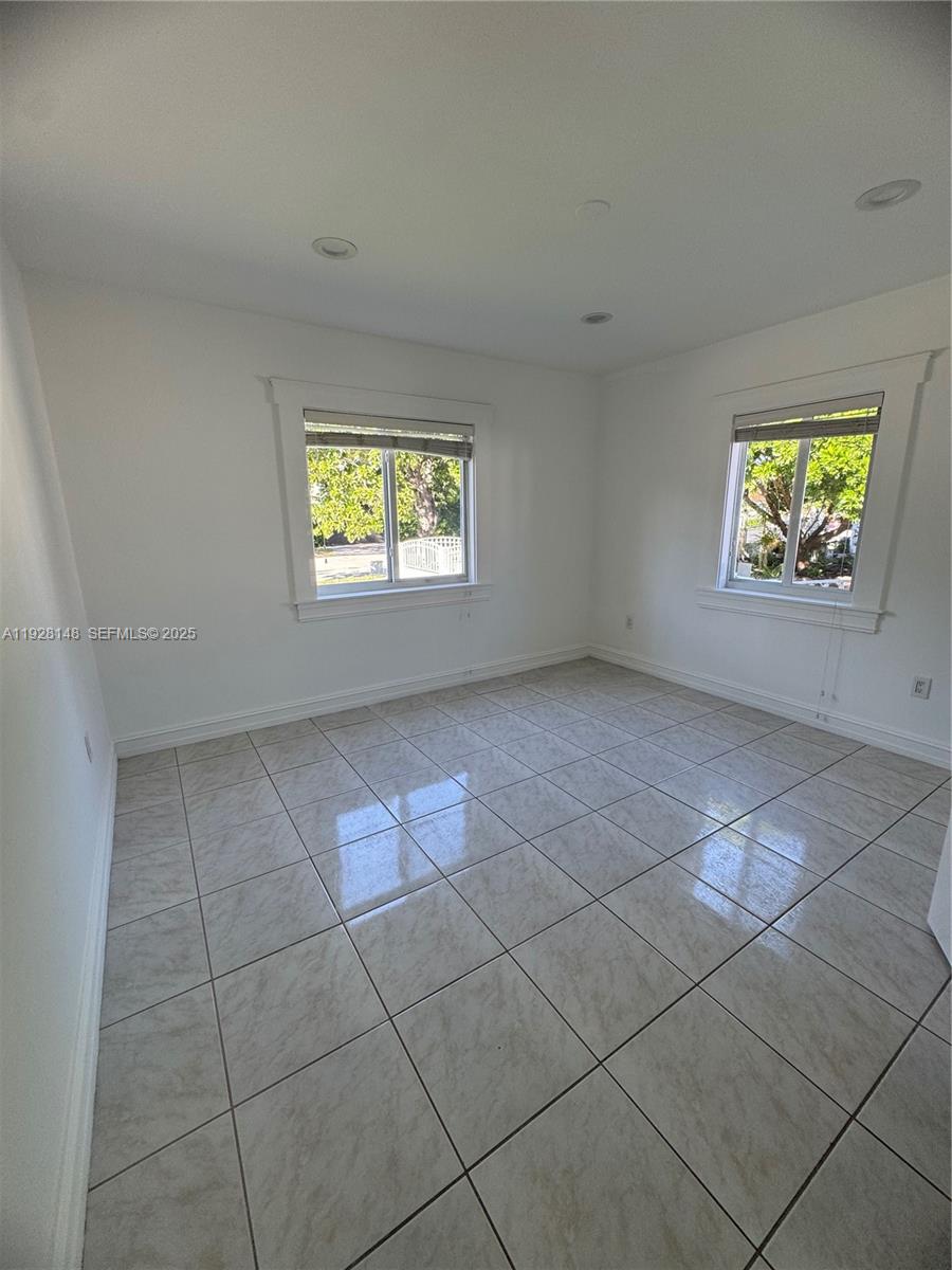3021 Southwest 2nd Avenue Miami, FL 33129 - Photo 7 of 29 an empty room with windows and wall