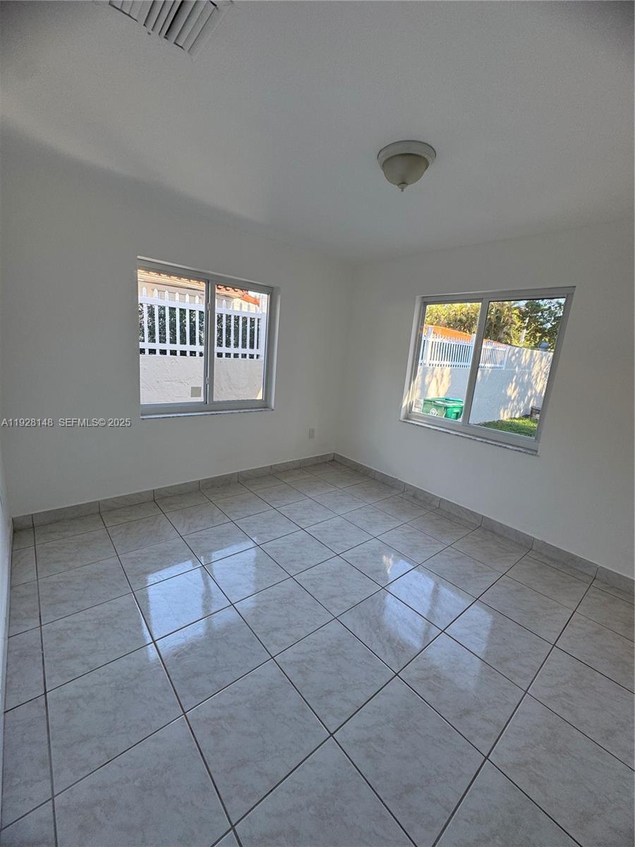 3021 Southwest 2nd Avenue Miami, FL 33129 - Photo 8 of 29 a view of an empty room with a window