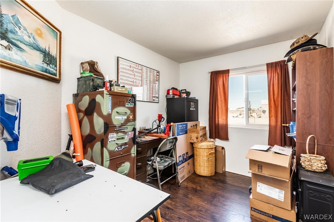 3535 Mobile Road Golden Valley, AZ 86413 - Photo 16 of 37 a view of a workspace with furniture and toys