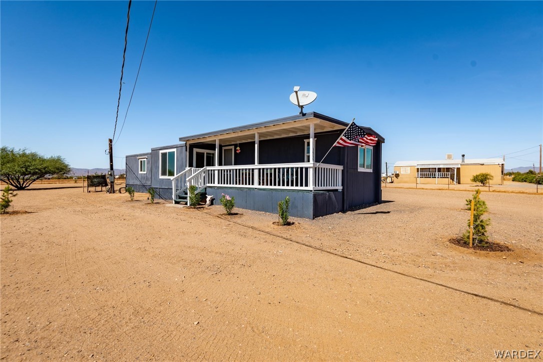 3535 Mobile Road Golden Valley, AZ 86413 - Photo 26 of 37 a front view of a house with a yard
