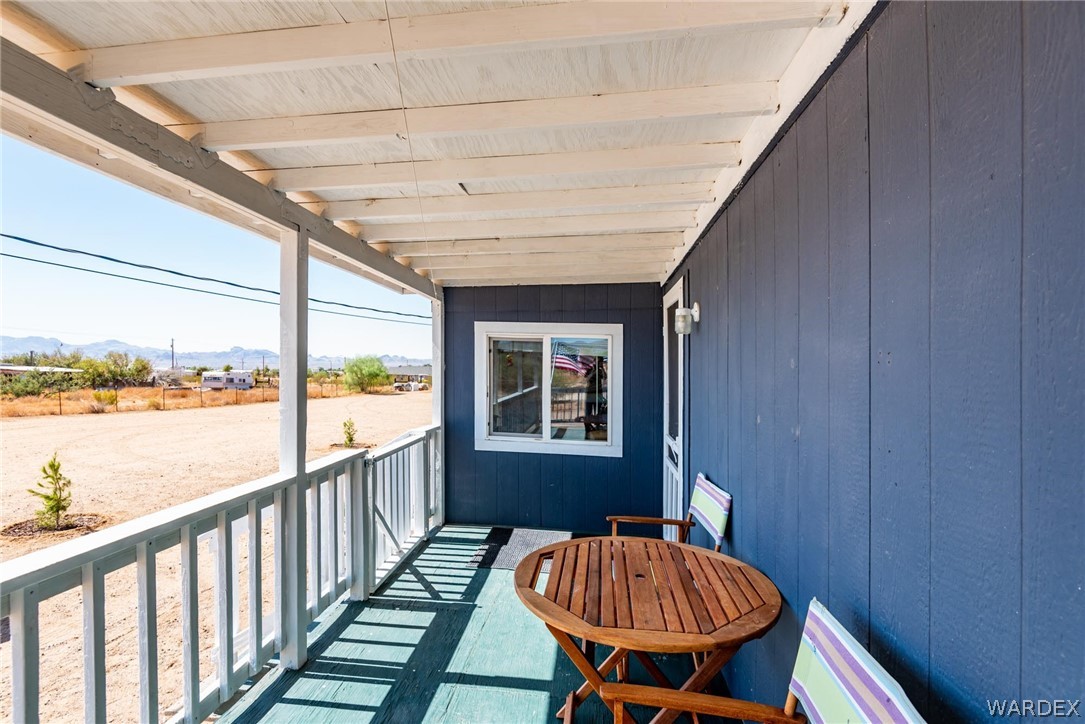 3535 Mobile Road Golden Valley, AZ 86413 - Photo 28 of 37 a balcony with table and chairs