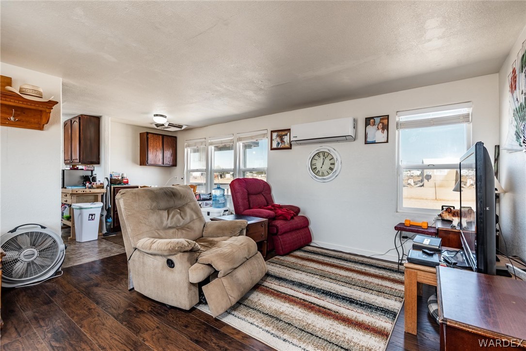 3535 Mobile Road Golden Valley, AZ 86413 - Photo 5 of 37 a living room with furniture and a flat screen tv