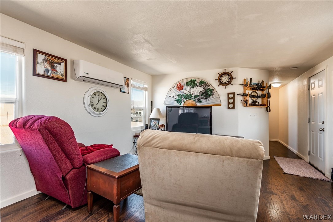 3535 Mobile Road Golden Valley, AZ 86413 - Photo 7 of 37 a living room with furniture and a wooden floor