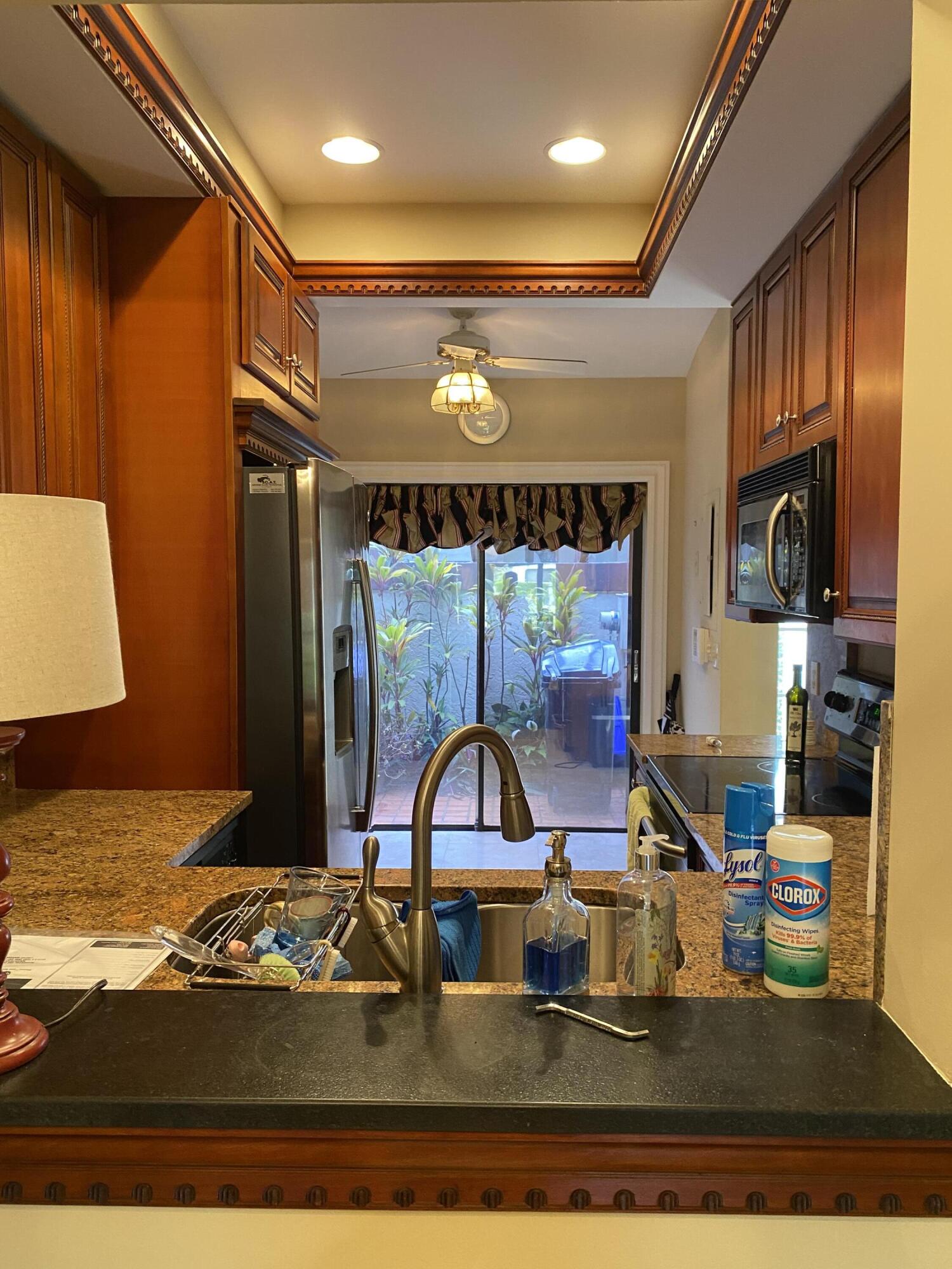 3584 Wash Road, Unit A Lake Worth, FL 33467 - Photo 17 of 31 view of pasthrough from DR to Kitchen