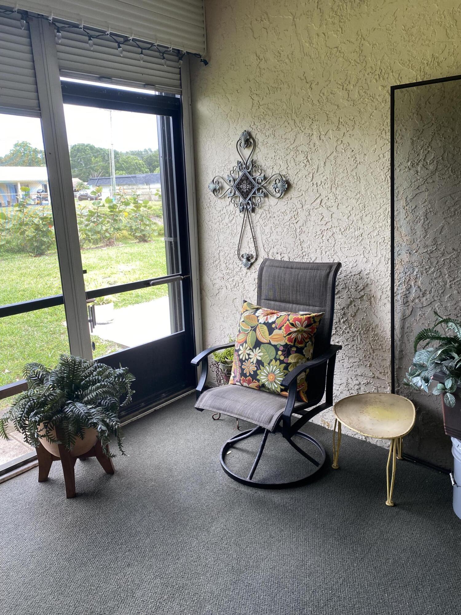 3584 Wash Road, Unit A Lake Worth, FL 33467 - Photo 20 of 31 Screened patio off LR