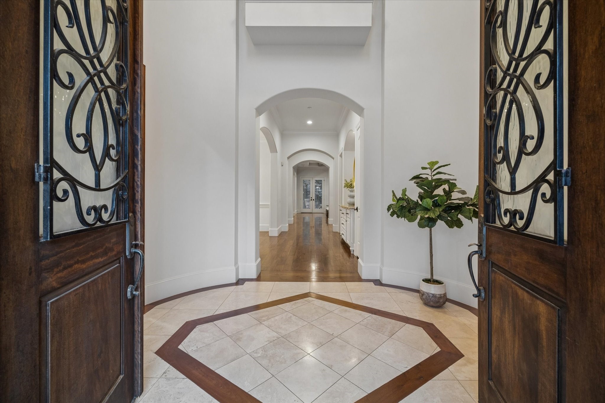 4511 Merrie Lane Bellaire, TX 77401 - Photo 12 of 49 A striking two-story foyer featuring refined tile and wood inlay detail
