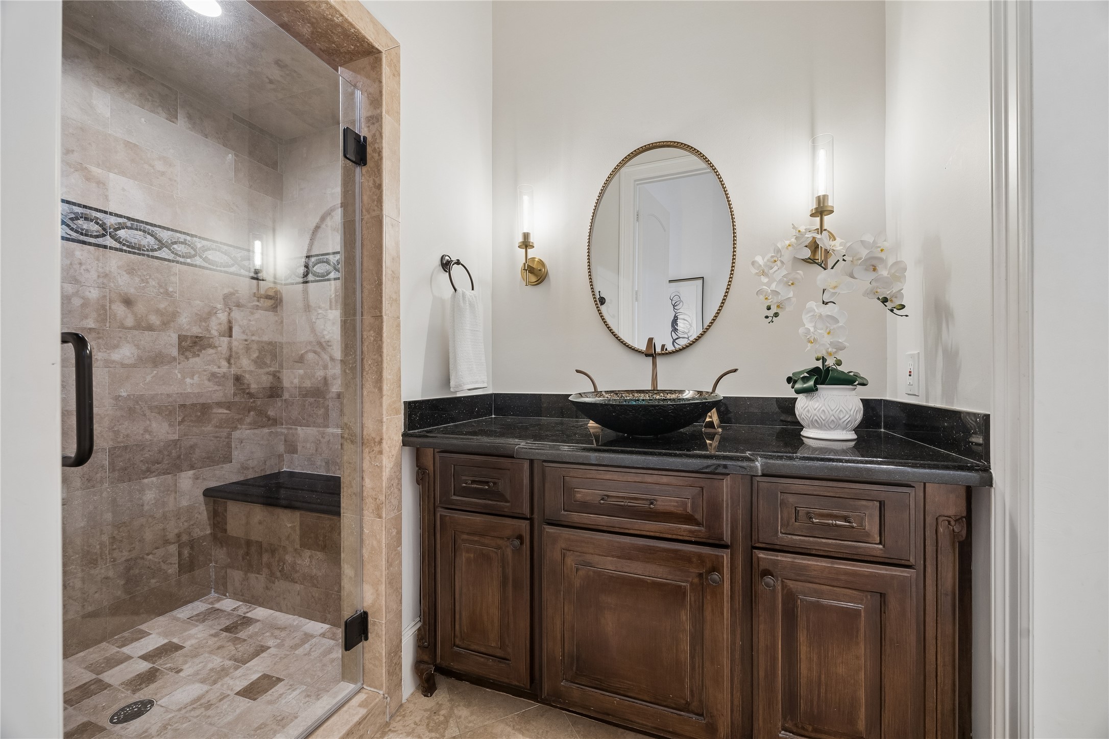 4511 Merrie Lane Bellaire, TX 77401 - Photo 41 of 49 a bathroom with a granite countertop sink a toilet and a mirror