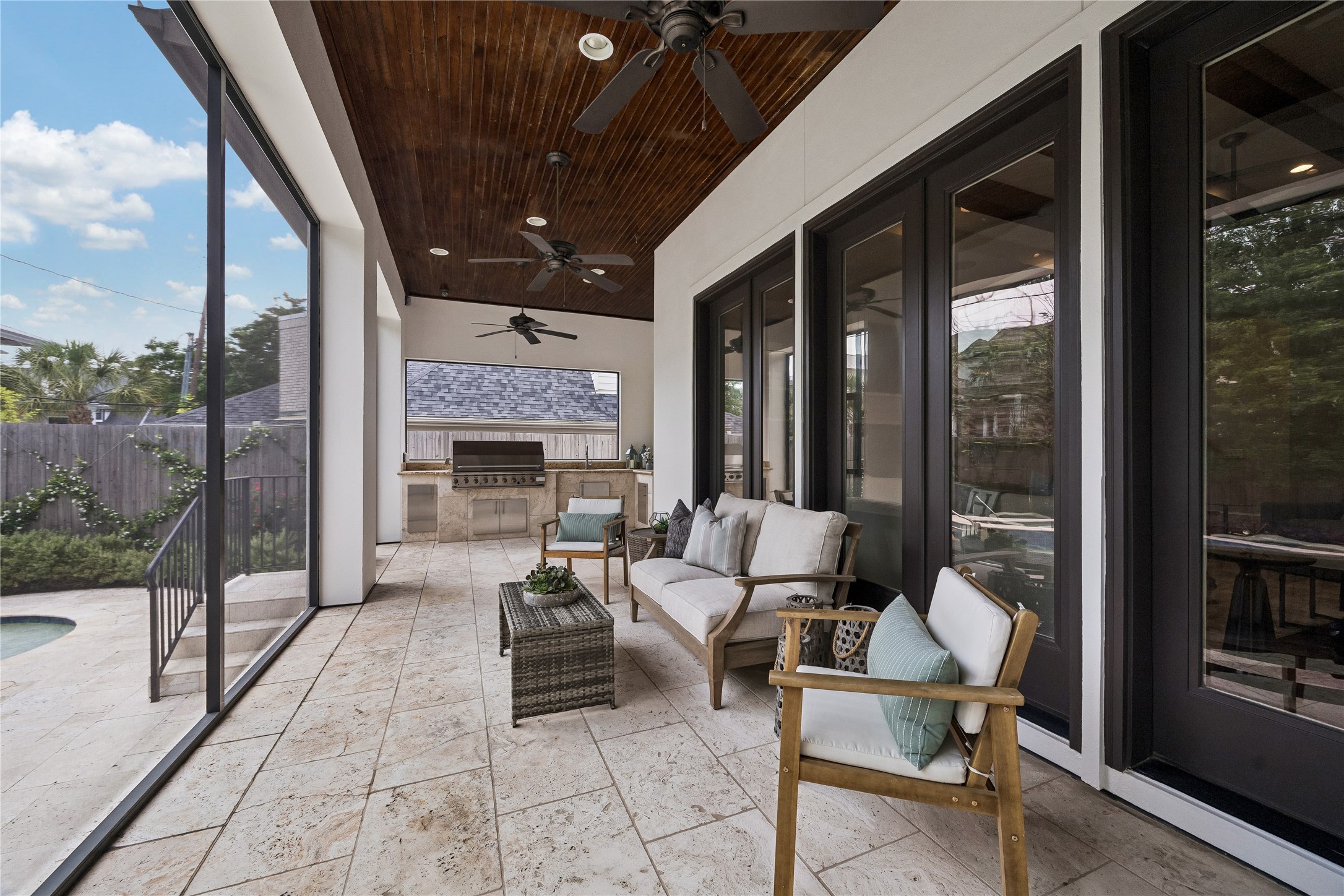 4511 Merrie Lane Bellaire, TX 77401 - Photo 43 of 49 Inviting screened porch off the living room, overlooking the pool