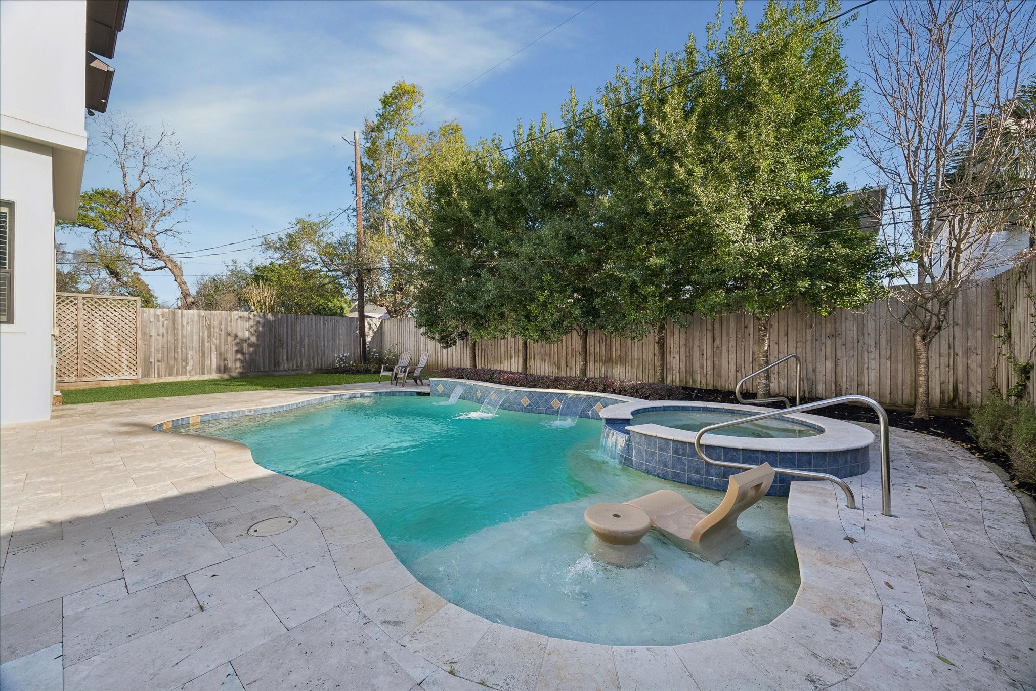 4511 Merrie Lane Bellaire, TX 77401 - Photo 47 of 49 a backyard of a house with table and chairs