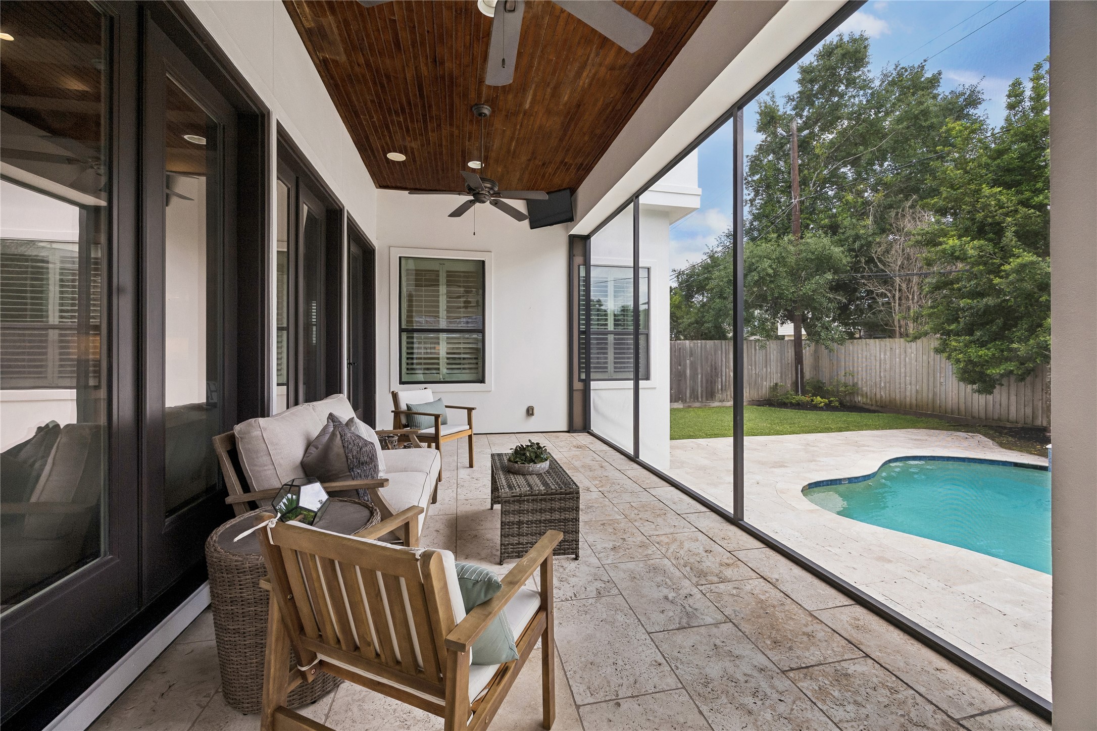 4511 Merrie Lane Bellaire, TX 77401 - Photo 48 of 49 The screened porch features a bead board ceiling and offers plenty of space