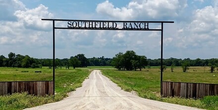 a view of a park with welcome board