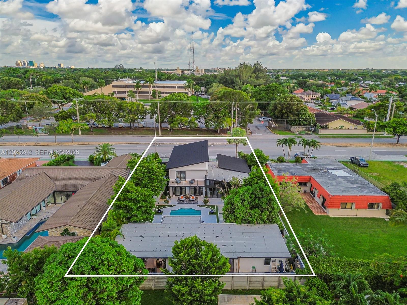 8761 Southwest 56th Street Miami, FL 33165 - Photo 11 of 90 an aerial view of house with yard swimming pool and outdoor seating