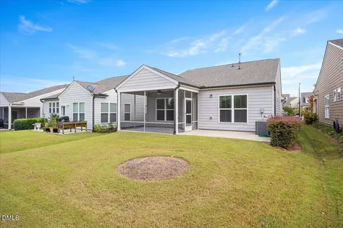 a view of a house with swimming pool and porch