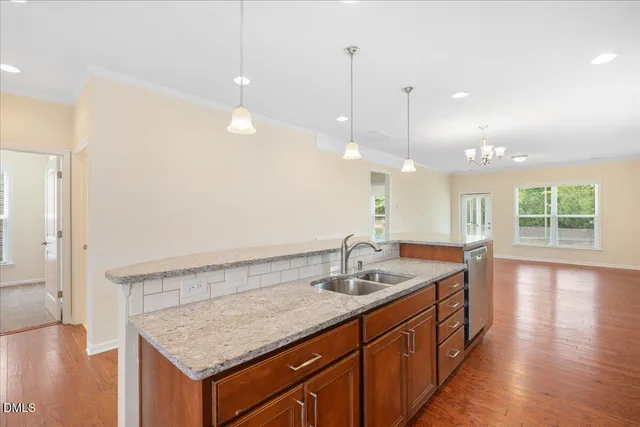 a bathroom with a sink a vanity and a large mirror