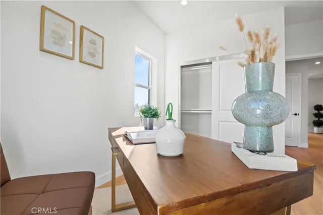 a bedroom with furniture and a window