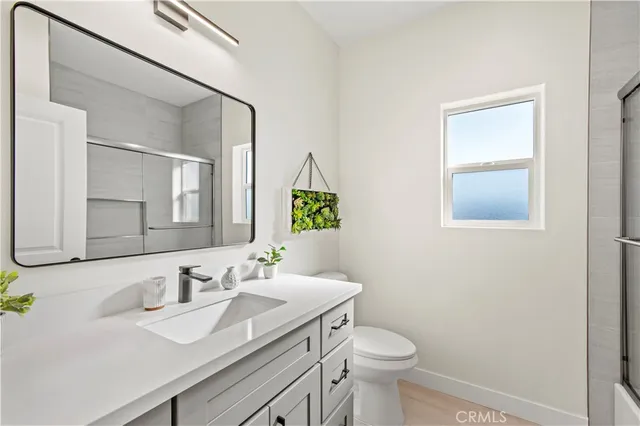 a bathroom with a toilet and a sink