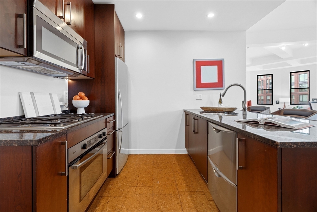 40 Fay Street, Unit 406 Boston, MA 02118 - Photo 6 of 19 a kitchen with stainless steel appliances granite countertop a stove and a sink