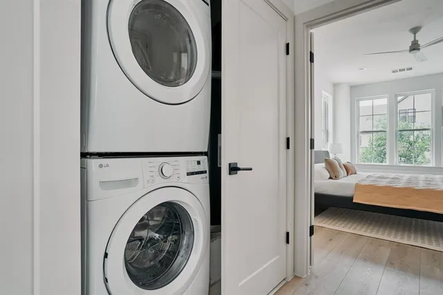 a view of a bedroom with washer and dryer