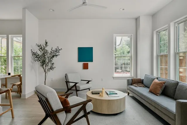 a living room with furniture and a large window