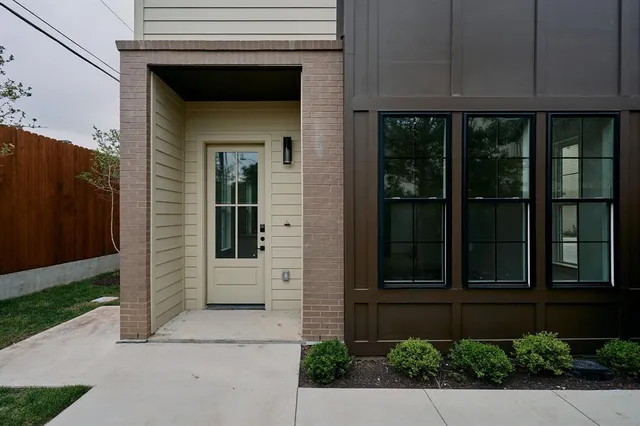 an aerial view of a residential houses with outdoor space