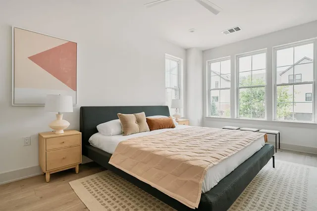 a bedroom with a large bed and a table