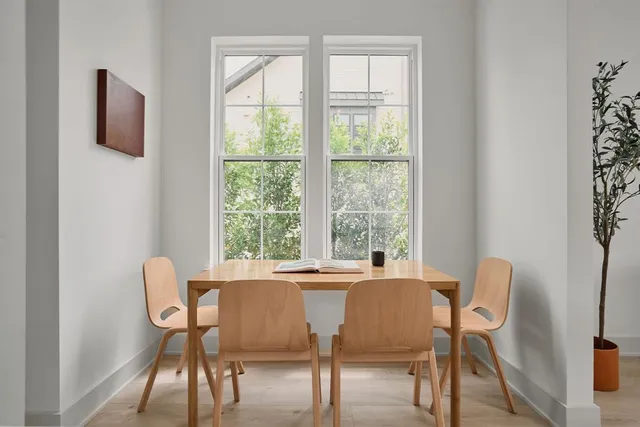 a view of a dining room with furniture window and outside view