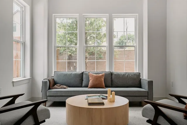 a living room with furniture and a window