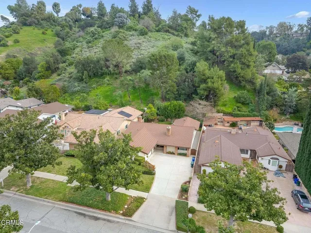 an aerial view of a houses with yard