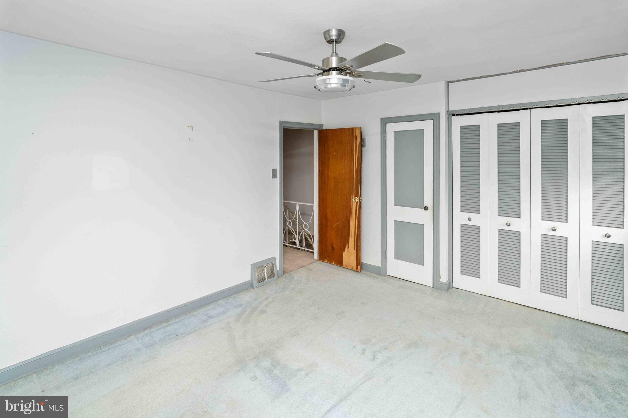 1130 Fanshawe Street Philadelphia, PA 19111 - Photo 13 of 32 an empty room with closet and a ceiling fan