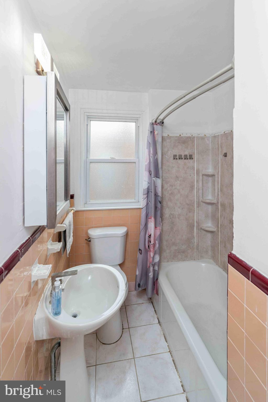 1130 Fanshawe Street Philadelphia, PA 19111 - Photo 14 of 32 a bathroom with a sink a toilet and shower