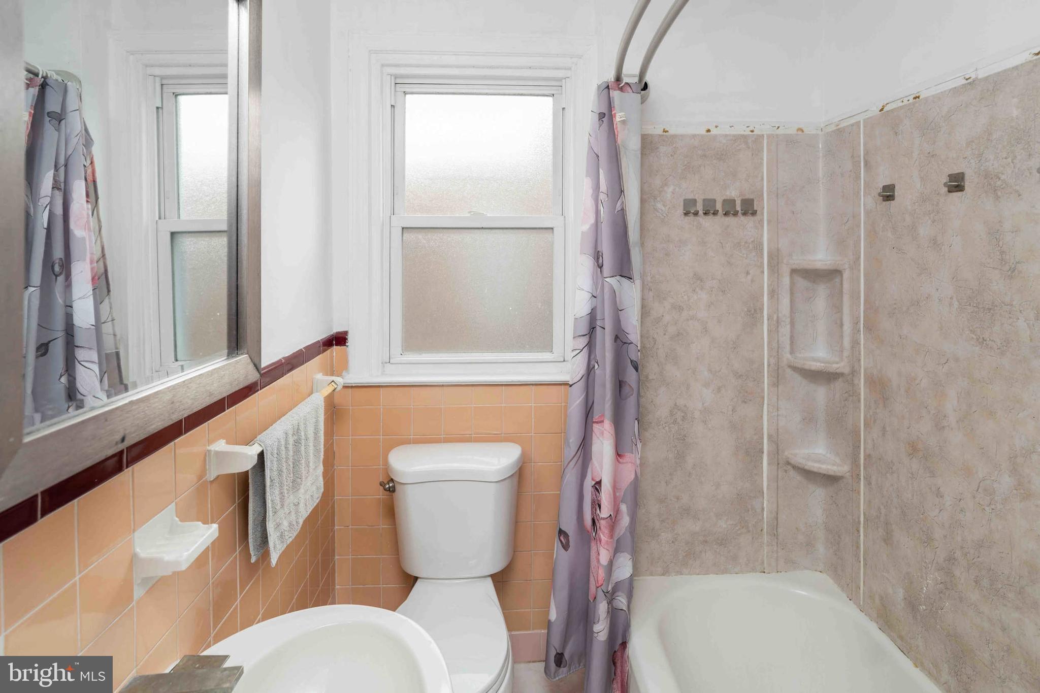 1130 Fanshawe Street Philadelphia, PA 19111 - Photo 15 of 32 a white toilet sitting next to a bath tub shower