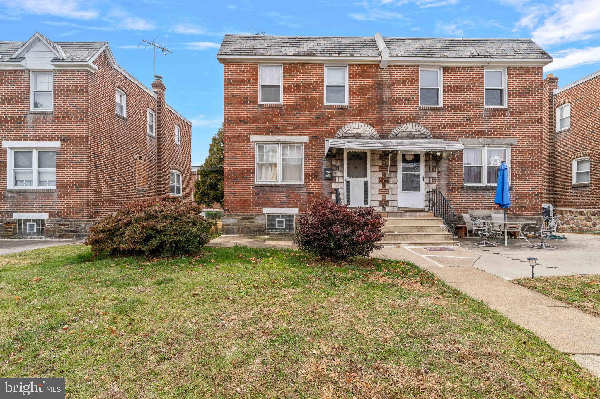 1130 Fanshawe Street Philadelphia, PA 19111 - Photo 25 of 32 a view of a house with a yard and lawn chairs
