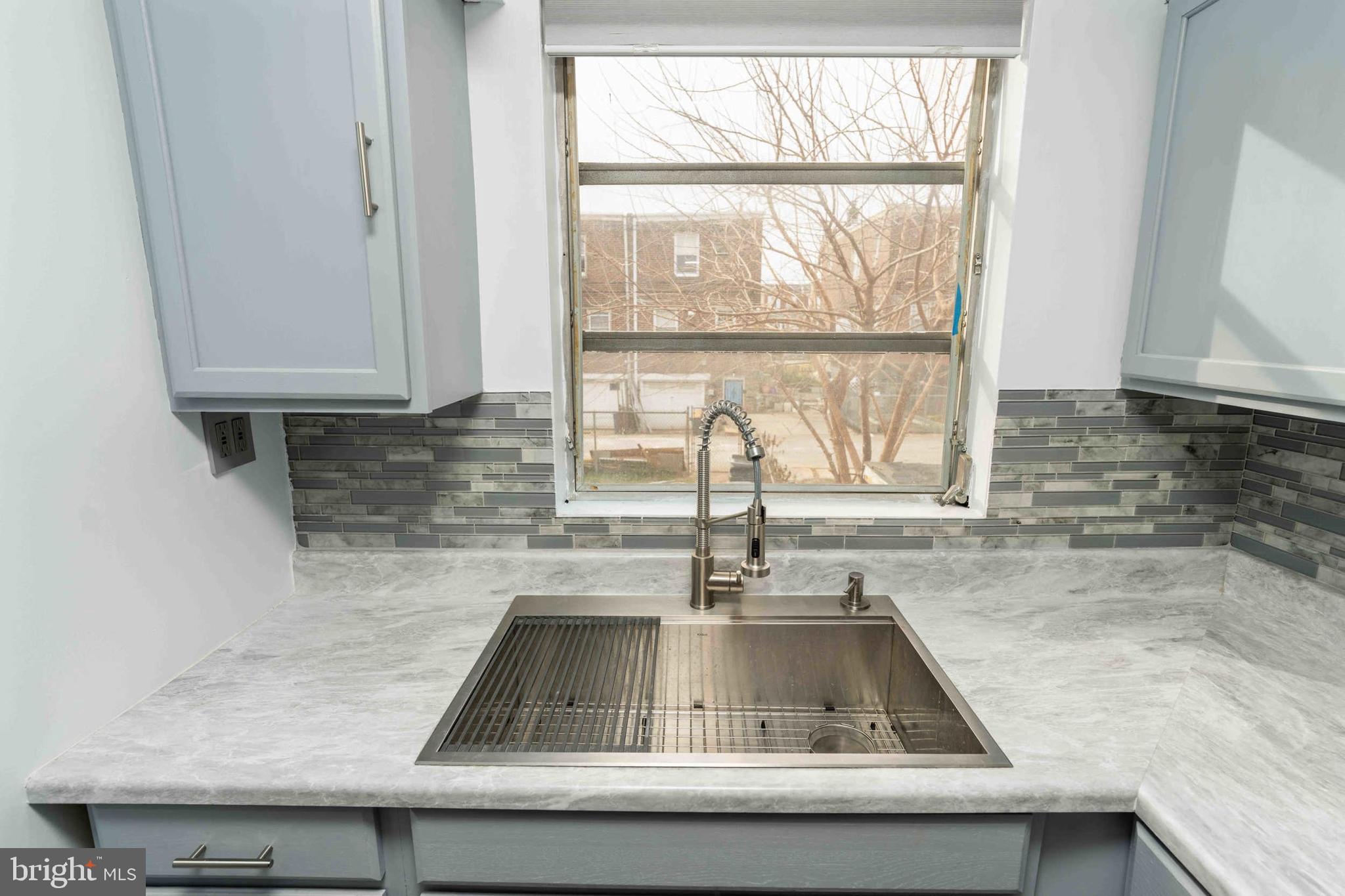 1130 Fanshawe Street Philadelphia, PA 19111 - Photo 6 of 32 a kitchen with granite countertop a sink and a window