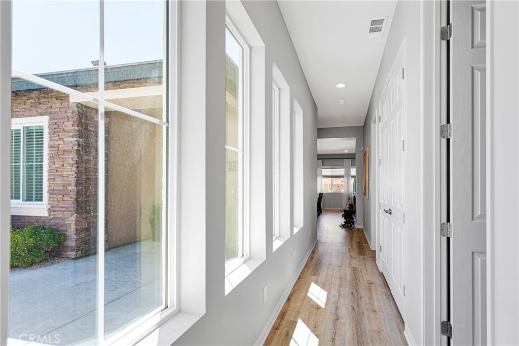 17066 Ta-Ki-Pi Road Apple Valley, CA 92307 - Photo 27 of 47 Excellent natural light. Junior suite is situated at the end of this hall.