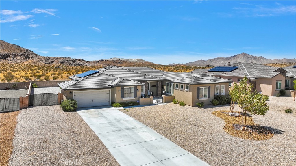 17066 Ta-Ki-Pi Road Apple Valley, CA 92307 - Photo 39 of 47 Privacy and views of the mountains, snow caps in the distance, and twinkling city lights at night.