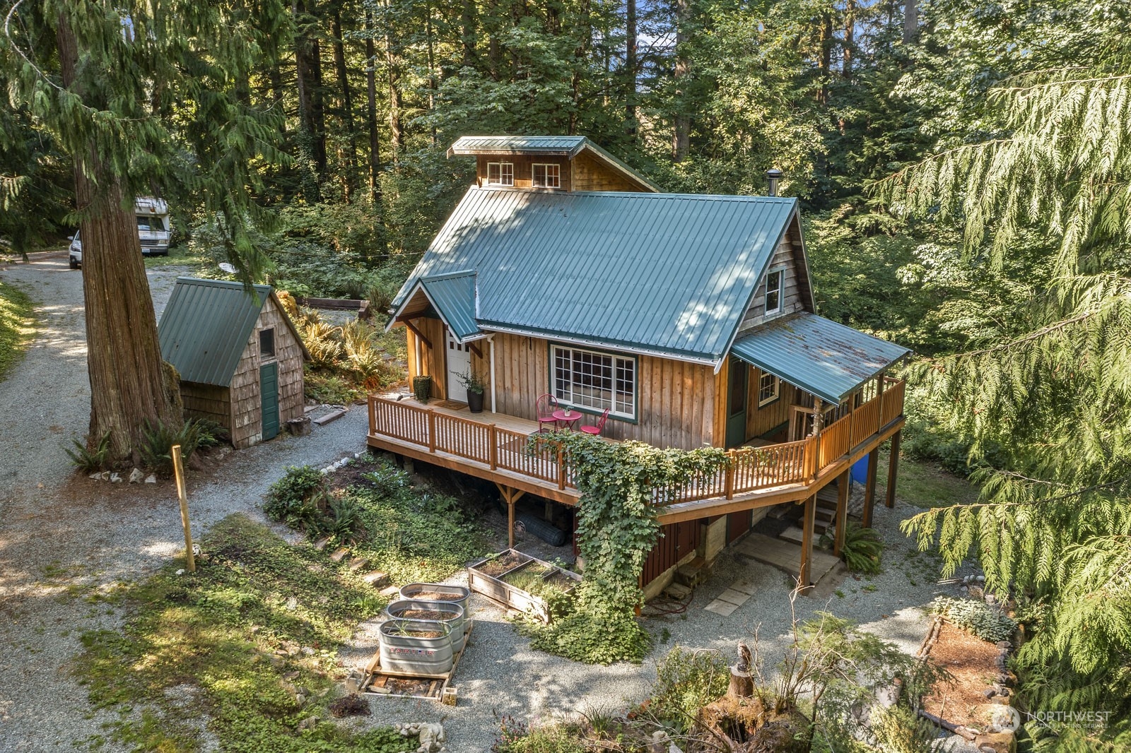 52703 Deep Woods Road Index, WA 98256 - Photo 26 of 29 an aerial view of a house with swimming pool next to a yard