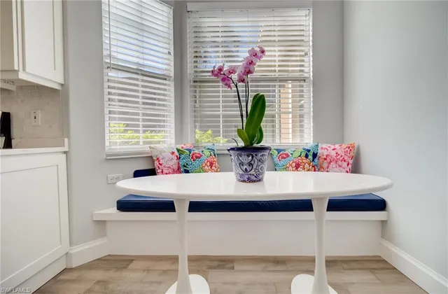 a dining room with table and chairs